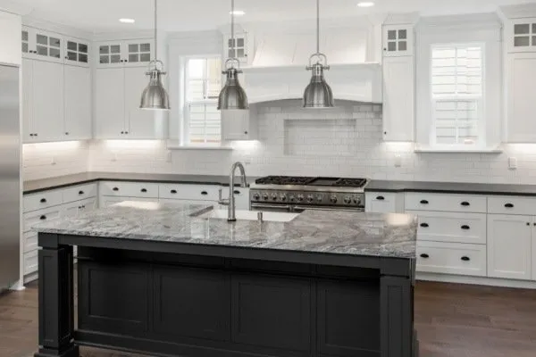 Black and white kitchen-Black countertops White cabinets Black island White tile backsplash-Springdale OH-Cincinnati Cabinet Refinishing-600x400